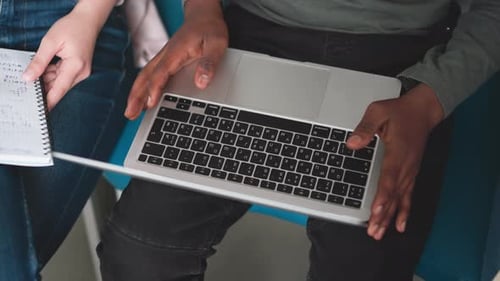 Typing On A Laptop with Notebook