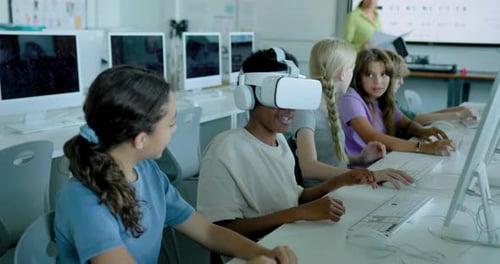 School Children in STEM Computer Classroom using Virtual Reality Headset