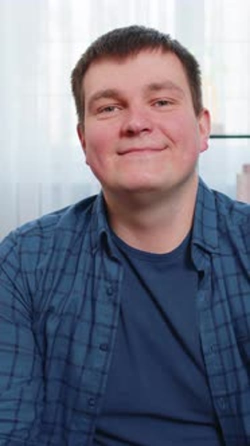 Adult Smiling and Looking at Camera Indoors