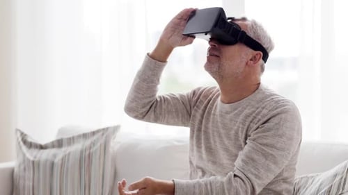 Senior Man Immersed in Virtual Reality Experience at Home