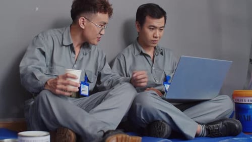 Home Service Specialists Discussing Plan of Work during Coffee Break