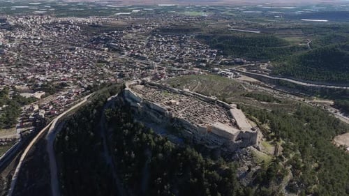 Historic Fortress Ruins in Turkey with Surrounding Cityscape