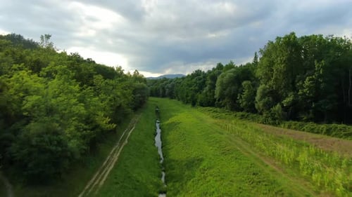Lake Butoniga Croatia water canal tributary system trench going up a hill , Aerial drone flyover ped