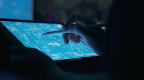 Architect Working on Blueprint on Tablet With Stylus