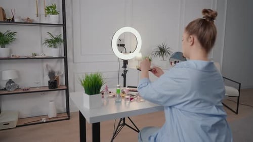 Woman Applying Makeup For Social Media Video