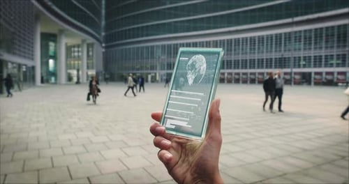 Futuristic Transparent Device with Globe in Urban Setting