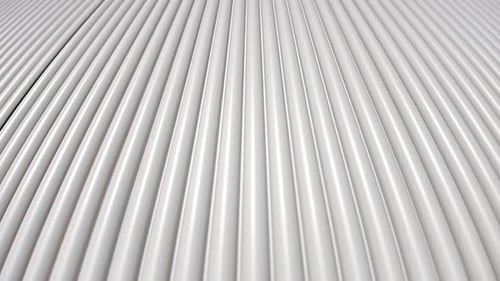 Grooved fronts of kitchen cabinets. New kitchen style.