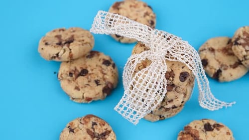 Cookies Stacked and Wrapped with Lace Ribbon on Blue