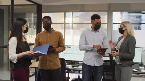 Four Business Colleagues in a Modern Office