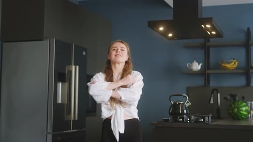 Portrait of Blonde Caucasian Woman Crossing Arms and Smiling at Home Young Cheerful Adult Female