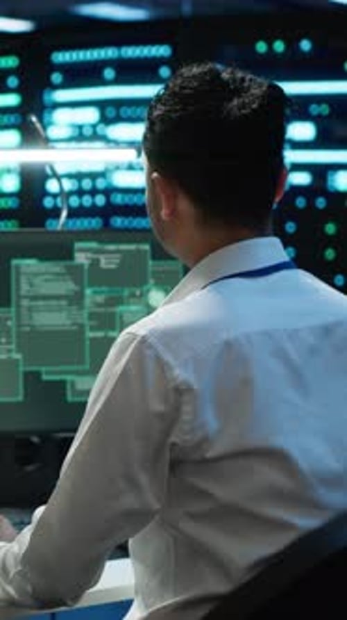 Vertical Video Engineer in Server Hub Frightened By Hacker Passing Company Firewall