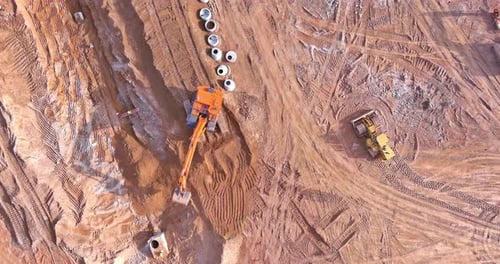 Aerial View of Heavy Machinery at Construction Site