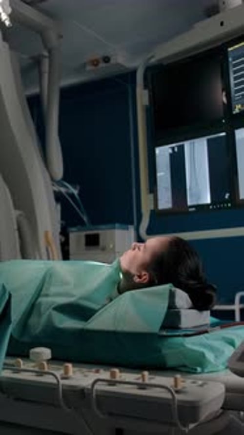 Vertical of Doctor Prepares Tools for Surgery