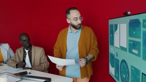 Business Team Meeting with Presentation in Office