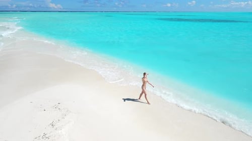 Woman Walking on Tropical White Sand Beach with Turquoise Ocean Aerial View Seascape with Female in