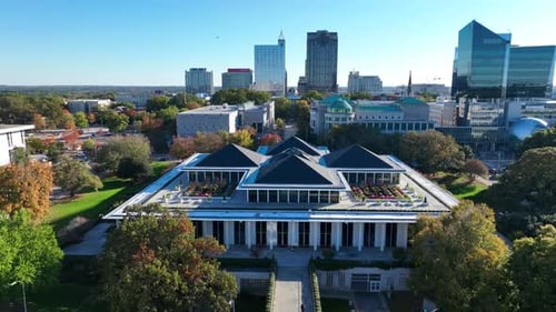 North Carolina legislative building and downtown Raleigh skyline with capitol complex. Aerial descen