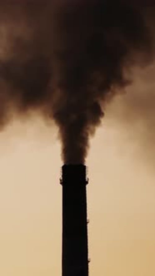 Industrial smoke from chimney. Smoke from the chimneys at the factory Vertical video