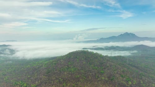 Aerial view morning scenery Mist flowing over the high mountains.