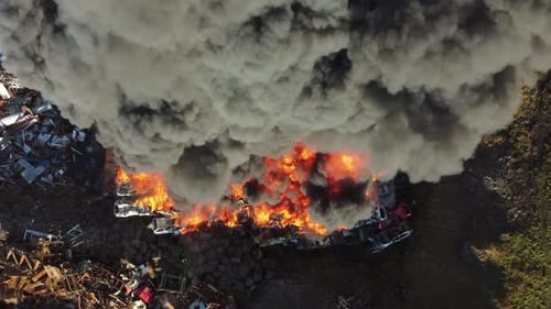 Fire at Car Junkyard Black Smoke Pollutes the Atmosphere Ecological Disaster Global Warming Problem