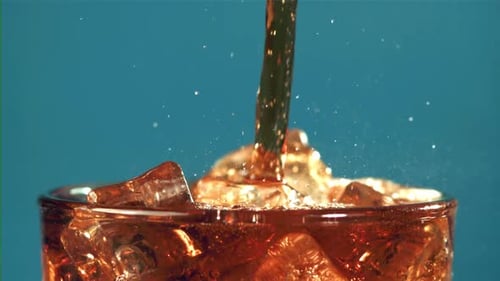Refreshing Drink being Poured into Iced Glass