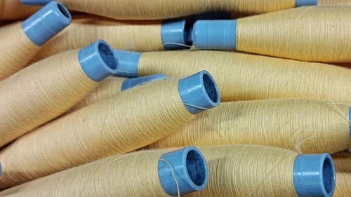 Close-Up of Yarn Spools for Textile Production