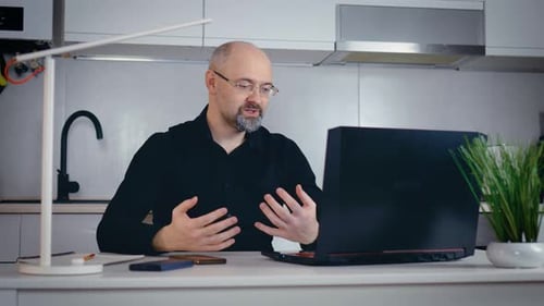 Man Working Remotely Talking on a Video Call