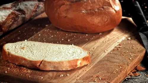 Sliced Bread Falls Onto a Cutting Board Filmed on a Highspeed Camera at 1000 Fps