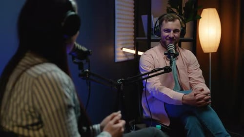 Podcast Hosts On Air Engaging in a Lively Discussion