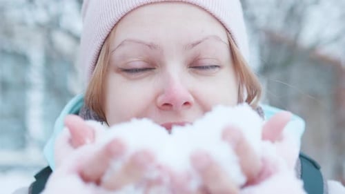 Sweet Beautiful Happy Smiling Winter Girl Blowing Snow Close Up