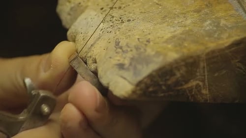 Italian Goldsmith at work building an engagement or a wedding ring.