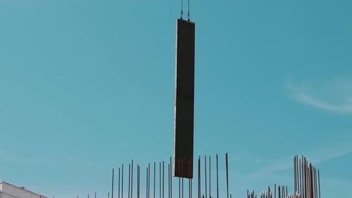 Formwork Panel Lowered By Crane Above Foundation Reinforcement