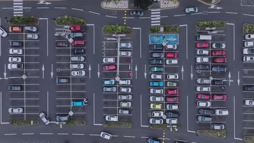 Top View Of A Large Parking Lot With Cars