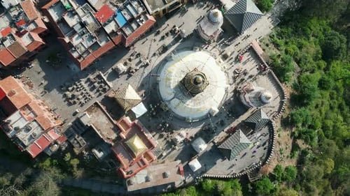 Aerial top view over Swayambhunath temple, ancient buddhist monastery, with prayer flags, Kathmandu,