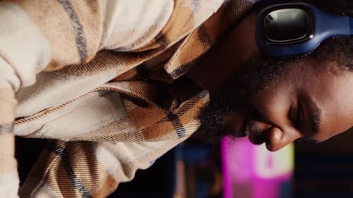 Man Wearing Headphones Listening to Music Indoors