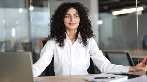 Businesswoman Meditating at Workplace Finding Peace and Calm in the Office