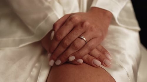 Elegant Woman's Hands with Diamond Ring Close Up