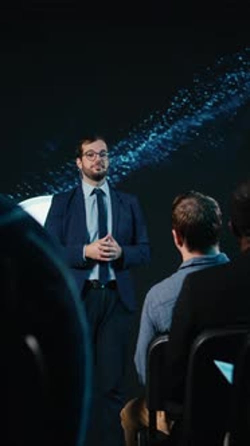 Man giving presentation in a suit and tie