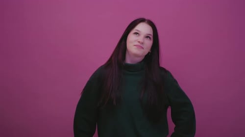 Teen Girl Looking Upwards on Pink Background