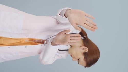 Female Doctor Blocking or Stopping Something