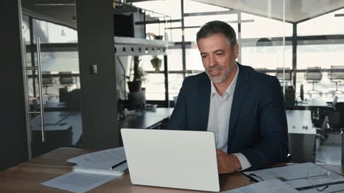 Mid Aged Business Man Manager Having Video Call Work Meeting in Office