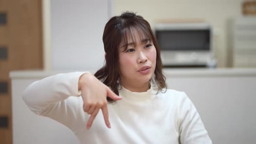 Young Woman Communicating with Hand Gestures