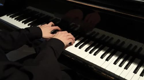 Hands Play Piano Keyboard Keys in Home Interior
