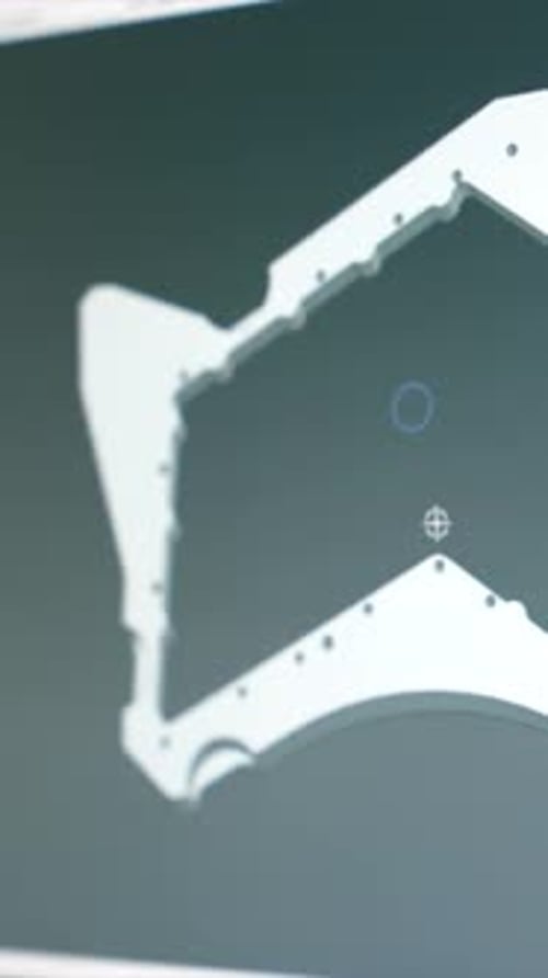 Ingenieros diseñan una pieza de metal en una computadora