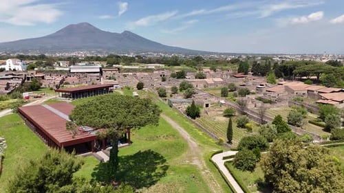 Drone footage of ancient Pompeii and Mount Vesuvius backdrop, Italy