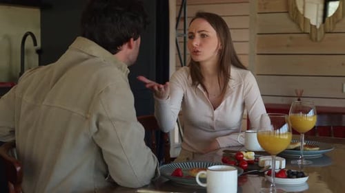 Couple Arguing at Breakfast Table