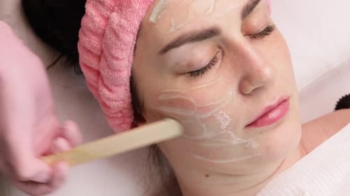 RF Lifting Applying the Gel to the Face of a Young Adult girlFacial Skin Care Facial Rejuvenation