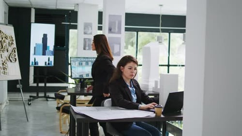 Architectural Technician Examines 3d Building Model