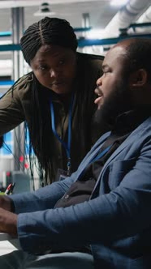 Colleagues Reviewing Data on Computer Screen at Workplace