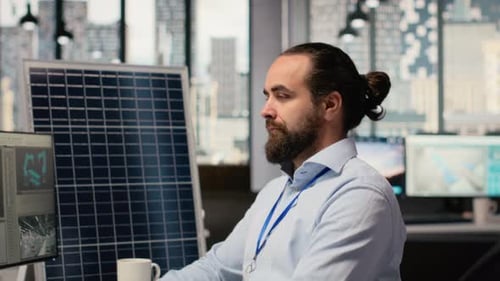 Portrait of Happy Sustainable Energy Researcher Using Simulation Software