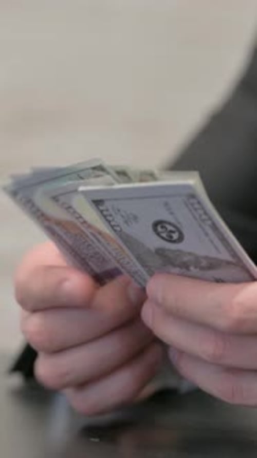 Close up of Businessman Counting Money, vertical video